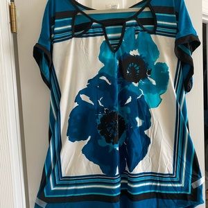 Comfy plus-sized poly top with keyhole neckline.